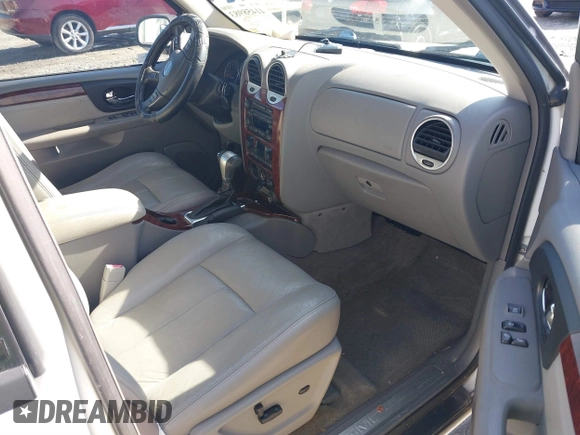 2006 GMC Envoy SLT with VIN 1GKDS13S062128531, listed as a IAAI auction lot 41458983 with 119,385 mi miles. Bid and sale history available at carsss.com. Image 5.