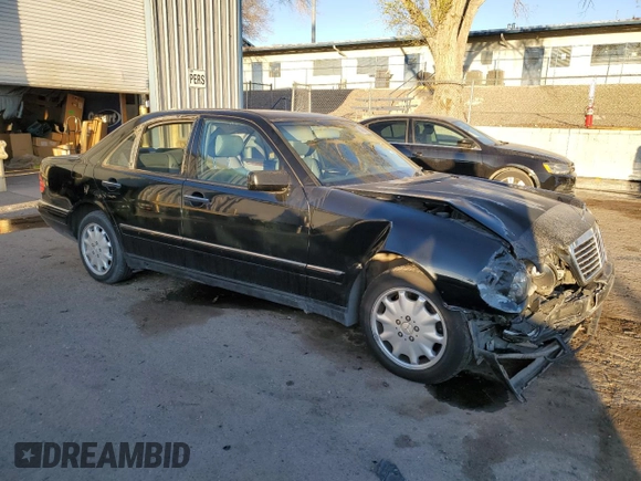 1999 Mercedes-Benz E-Class with VIN WDBJF82H9XX026911, listed as a Copart auction lot 48808835 with 205,953 mi miles and Salvage Title. Bid and sale history available at carsss.com. Image 4.