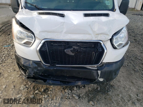 2021 Ford Transit Cargo with VIN 1FTBR1Y87MKA44540, listed as a Copart auction lot 74791034 with 128,242 mi miles and Salvage title. Bid and sale history available at DreamBid. Image 12.