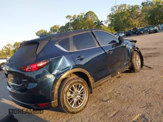 2021 Mazda CX-5 Touring with VIN JM3KFACM2M0450340, listed as a IAAI auction lot 42059613 with 38,960 mi miles and . Bid and sale history available at carsss.com. Image 4.