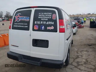 2019 Chevrolet Express Cargo Van with VIN 1GCWGAFP6K1243793, listed as a IAAI auction lot 41799107 with 106,566 mi miles. Bid and sale history available at carsss.com. Image 4.