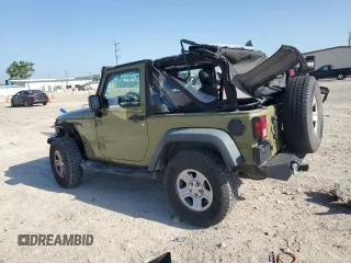 2013 Jeep Wrangler Sport with VIN 1C4AJWAG3DL649487, listed as a Copart auction lot 52568285 with 106,644 mi miles and Salvage title. Bid and sale history available at DreamBid. Image 2.