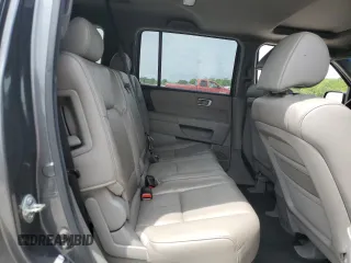 2011 Honda Pilot EX-L z VIN 5FNYF3H76BB048918, wystawiony jako Copart lot #53749895 z przebiegiem 213 710 mil mil oraz Szkoda całkowita • Salvage title. Historia ofert i sprzedaży dostępna na DreamBid. Obrazek 11.