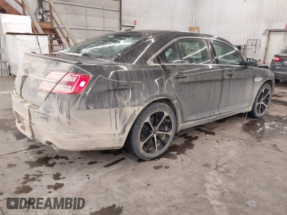 2014 Ford Taurus SEL with VIN 1FAHP2E87EG117653, listed as a IAAI auction lot 41589415 with 125,040 mi miles. Bid and sale history available at carsss.com. Image 4.