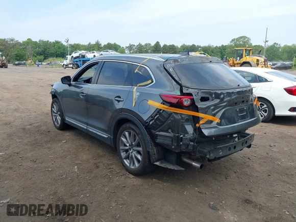 2020 Mazda CX-9 Grand Touring with VIN JM3TCBDY4L0408920, listed as a IAAI auction lot 42325272 with 45,837 mi miles and . Bid and sale history available at DreamBid. Image 3.