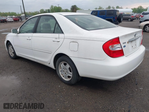 2003 Toyota Camry LE z VIN 4T1BF30K93U044730, wystawiony jako IAAI lot #42044599 z przebiegiem 120 401 mil mil oraz . Historia ofert i sprzedaży dostępna na DreamBid. Obrazek 3.