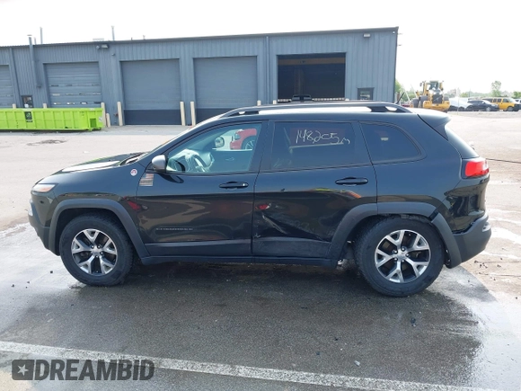 2015 Jeep Cherokee Trailhawk with VIN 1C4PJMBS6FW786622, listed as a IAAI auction lot 42403215 with 148,205 mi miles and . Bid and sale history available at DreamBid. Image 14.