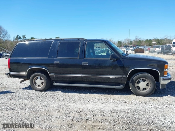 1999 Chevrolet Suburban with VIN 3GNEC16R0XG137834, listed as a IAAI auction lot 41853492 with 296,147 mi miles. Bid and sale history available at carsss.com. Image 13.