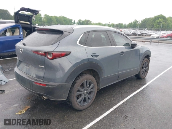 2023 Mazda CX-30 S Carbon Edition with VIN 3MVDMBCM9PM574358, listed as a IAAI auction lot 42105931 with 55,975 mi miles and . Bid and sale history available at DreamBid. Image 4.