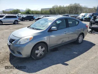 2012 Nissan Versa SV with VIN 3N1CN7AP0CL946595, listed as a Copart auction lot 59562915 with 107,228 mi miles and Salvage title. Bid and sale history available at DreamBid. Image 1.