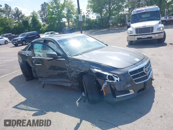 2014 Cadillac CTS Luxury AWD z VIN 1G6AX5SX7E0173466, wystawiony jako IAAI lot #42187266 z przebiegiem 115 140 mil mil oraz . Historia ofert i sprzedaży dostępna na DreamBid. Obrazek 1.