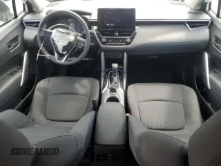 2023 Toyota Corolla Cross LE with VIN 7MUCAAAG2PV053730, listed as a Copart auction lot 54825035 with 33,313 mi miles and Salvage title. Bid and sale history available at DreamBid. Image 8.