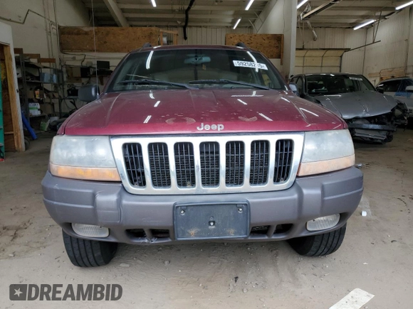 2001 Jeep Grand Cherokee Laredo z VIN 1J4GW48S11C609344, wystawiony jako Copart lot #59258245 z przebiegiem 162 141 mil mil oraz Szkoda całkowita • Salvage title. Historia ofert i sprzedaży dostępna na DreamBid. Obrazek 5.