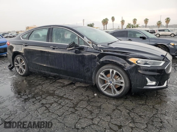 2020 Ford Fusion Titanium with VIN 3FA6P0D94LR153375, listed as a Copart auction lot 59609415 with 104,292 mi miles and Clean title. Bid and sale history available at DreamBid. Image 4.