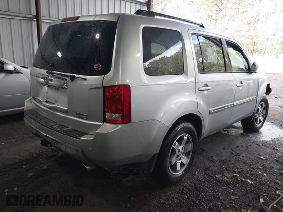 2011 Honda Pilot Touring with VIN 5FNYF4H90BB084692, listed as a IAAI auction lot 41867622 with 62,805 mi miles. Bid and sale history available at carsss.com. Image 4.