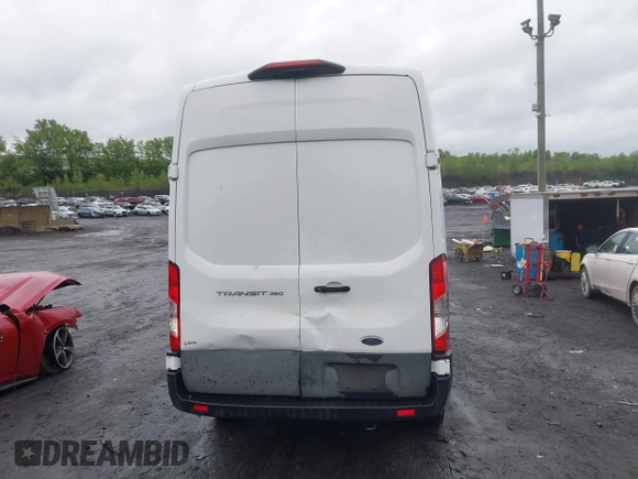 2021 Ford Transit Cargo with VIN 1FTBW1X84MKA98047, listed as a IAAI auction lot 42313747 with 65,600 mi miles and . Bid and sale history available at DreamBid. Image 16.