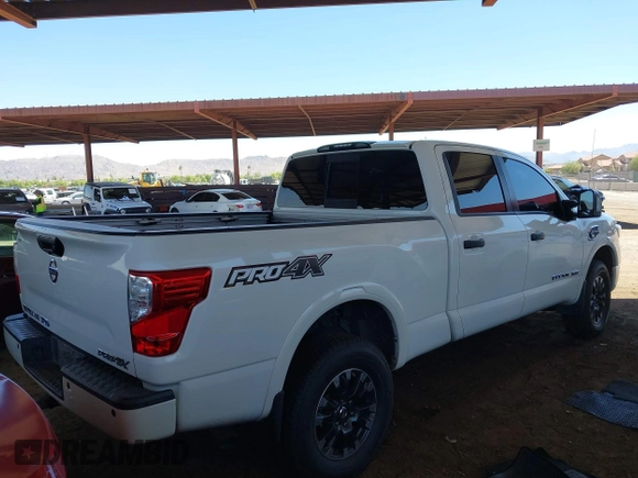 2019 Nissan Titan Pro-4X with VIN 1N6BA1F45KN533051, listed as a IAAI auction lot 42587343 with 134,768 mi miles and . Bid and sale history available at DreamBid. Image 4.