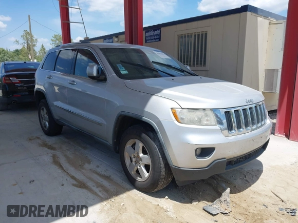 2011 Jeep Grand Cherokee Laredo with VIN 1J4RR4GG3BC540655, listed as a IAAI auction lot 42158522 with 214,341 mi miles and . Bid and sale history available at DreamBid. Image 1.