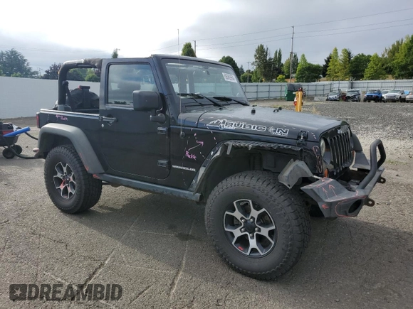 2011 Jeep Wrangler Rubicon with VIN 1J4BA6D12BL507652, listed as a Copart auction lot 69989964 with 127,493 mi miles and Salvage title. Bid and sale history available at DreamBid. Image 4.