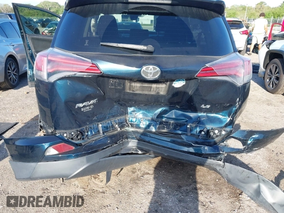 2018 Toyota RAV4 LE with VIN JTMZFREV1JJ203943, listed as a IAAI auction lot 41921863 with 104,691 mi miles. Bid and sale history available at carsss.com. Image 6.