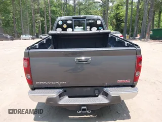 2012 GMC Canyon SLE2 z VIN 1GTJ6PFE2C8128602, wystawiony jako IAAI lot #42421110 z przebiegiem 79 273 mil mil oraz . Historia ofert i sprzedaży dostępna na DreamBid. Obrazek 16.