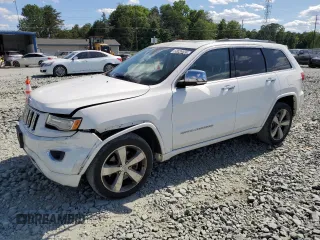 2015 Jeep Grand Cherokee Overland z VIN 1C4RJFCT6FC706622, wystawiony jako Copart lot #58036655 z przebiegiem 223 677 mil mil oraz Szkoda całkowita • Salvage title. Historia ofert i sprzedaży dostępna na DreamBid. Obrazek 1.