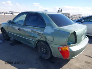 2005 Hyundai Accent GLS with VIN KMHCG45C95U620716, listed as a IAAI auction lot 41740573 with 187,971 mi miles. Bid and sale history available at carsss.com. Image 3.
