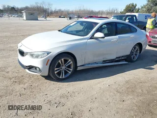 2016 BMW 4 Series 428i xDrive with VIN WBA4C9C59GG138090, listed as a IAAI auction lot 41560267 with 94,010 mi miles and . Bid and sale history available at carsss.com. Image 2.