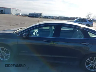 2016 Ford Fusion Titanium Hybrid with VIN 3FA6P0RU6GR156622, listed as a IAAI auction lot 41178887 with 92,423 mi miles. Bid and sale history available at carsss.com. Image 15.