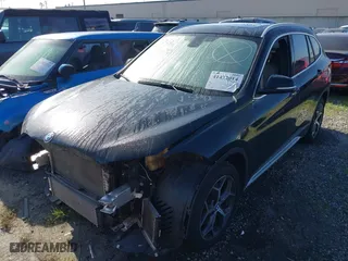 2018 BMW X1 sDrive28i with VIN WBXHU7C39J5L07129, listed as a IAAI auction lot 41472014 with 56,486 mi miles. Bid and sale history available at carsss.com. Image 2.