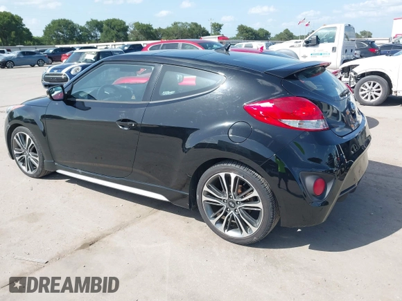 2016 Hyundai Veloster Turbo z VIN KMHTC6AE7GU255020, wystawiony jako IAAI lot #42720287 z przebiegiem 89 629 mil mil oraz . Historia ofert i sprzedaży dostępna na DreamBid. Obrazek 3.