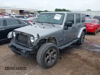 2016 Jeep Wrangler Unlimited Sahara z VIN 1C4BJWEGXGL280016, wystawiony jako IAAI lot #42620102 z przebiegiem 128 232 mil mil oraz . Historia ofert i sprzedaży dostępna na DreamBid. Obrazek 2.