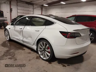 2018 Tesla Model 3 Long Range Battery with VIN 5YJ3E1EB5JF084446, listed as a IAAI auction lot 41209852 with 70,125 mi miles and . Bid and sale history available at DreamBid. Image 3.