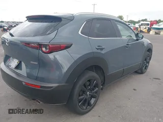 2022 Mazda CX-30 S Carbon Edition with VIN 3MVDMBCL6NM431985, listed as a IAAI auction lot 42610558 with Not provided miles and . Bid and sale history available at DreamBid. Image 4.