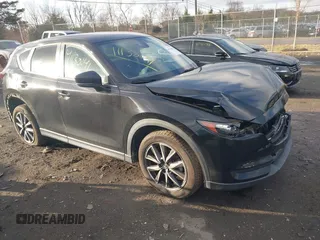 2018 Mazda CX-5 Touring z VIN JM3KFACM3J1435089, wystawiony jako IAAI lot #41130041 z przebiegiem 80 446 mil mil oraz . Historia ofert i sprzedaży dostępna na DreamBid. Obrazek 1.