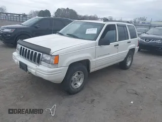 1998 Jeep Grand Cherokee Laredo with VIN 1J4GZ48S3WC204990, listed as a IAAI auction lot 41704176 with 185,376 mi miles. Bid and sale history available at carsss.com. Image 2.