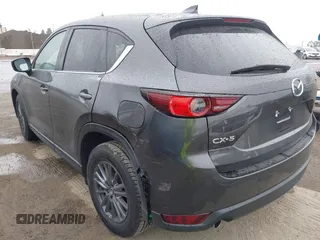 2021 Mazda CX-5 Touring with VIN JM3KFACM6M0480487, listed as a IAAI auction lot 41731646 with 26,951 mi miles and . Bid and sale history available at carsss.com. Image 3.