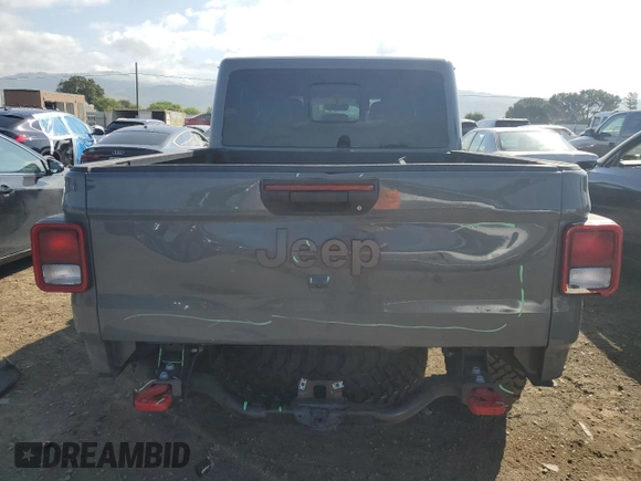 2023 Jeep Gladiator Rubicon with VIN 1C6JJTBG8PL550219, listed as a Copart auction lot 54627685 with 9,671 mi miles and Salvage title. Bid and sale history available at DreamBid. Image 6.