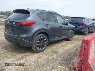 2016 Mazda CX-5 Grand Touring with VIN JM3KE4DYXG0830150, listed as a IAAI auction lot 41961007 with 142,570 mi miles and . Bid and sale history available at DreamBid. Image 4.