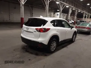 2016 Mazda CX-5 Touring z VIN JM3KE4CY0G0853261, wystawiony jako IAAI lot #41861176 z przebiegiem 63 491 mil mil oraz . Historia ofert i sprzedaży dostępna na DreamBid. Obrazek 4.
