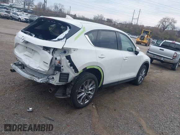 2020 Mazda CX-5 Grand Touring with VIN JM3KFBDM5L0731373, listed as a IAAI auction lot 41900567 with 31,268 mi miles and . Bid and sale history available at DreamBid. Image 4.