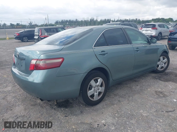 2007 Toyota Camry CE with VIN 4T1BE46K37U569515, listed as a IAAI auction lot 41974482 with 242,042 mi miles. Bid and sale history available at carsss.com. Image 4.
