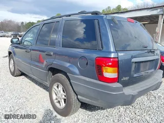 2004 Jeep Grand Cherokee Laredo with VIN 1J4GX48S14C324581, listed as a IAAI auction lot 41717938 with 213,178 mi miles. Bid and sale history available at carsss.com. Image 3.