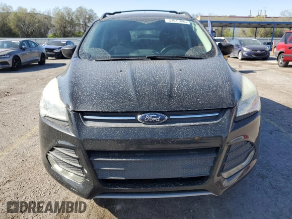 2013 Ford Escape SE with VIN 1FMCU0GX8DUA38056, listed as a Copart auction lot 57617885 with 128,467 mi miles and Salvage title. Bid and sale history available at DreamBid. Image 5.