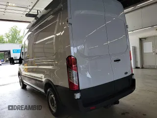 2023 Ford Transit Cargo with VIN 1FTBR1X86PKB99022, listed as a IAAI auction lot 42841650 with 14,234 mi miles and . Bid and sale history available at DreamBid. Image 23.