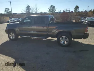 2010 Toyota Tacoma PreRunner with VIN 3TMKU4HN3AM025218, listed as a Copart auction lot 87600035 with 92,605 mi miles and Salvage title. Bid and sale history available at DreamBid. Image 2.