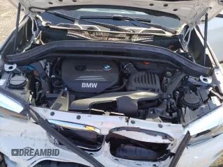 2018 BMW X1 xDrive28i z VIN WBXHT3C35J5F89977, wystawiony jako Copart lot #58464345 z przebiegiem 45 468 mil mil oraz Szkody całkowita. Historia ofert i sprzedaży dostępna na DreamBid. Obrazek 12.