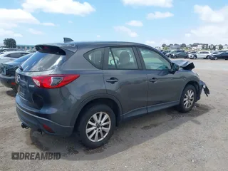 2014 Mazda CX-5 Sport with VIN JM3KE2BE0E0411377, listed as a IAAI auction lot 42143229 with 137,384 mi miles and . Bid and sale history available at carsss.com. Image 4.