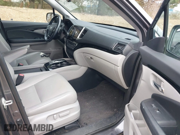 2017 Honda Pilot Touring with VIN 5FNYF6H92HB012090, listed as a IAAI auction lot 41882542 with 110,179 mi miles and . Bid and sale history available at DreamBid. Image 5.