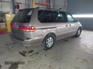 2003 Honda Odyssey EX-L with VIN 5FNRL18923B117592, listed as a IAAI auction lot 41546119 with 212,755 mi miles and . Bid and sale history available at DreamBid. Image 4.